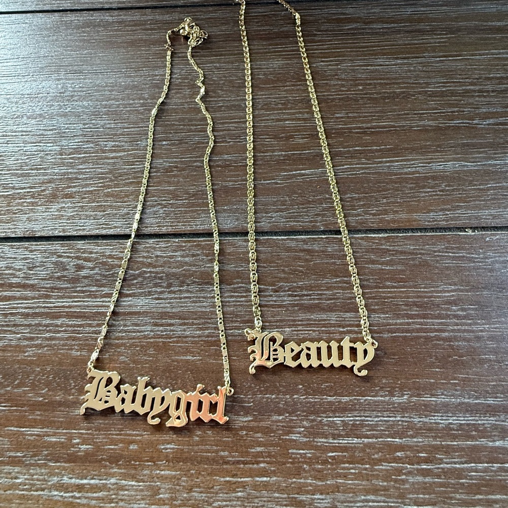 Gold Tone 'Babygirl' and 'Beauty' Necklaces